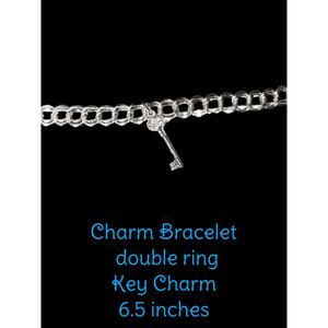 Charm bracelet with key charm